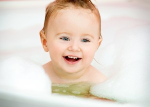 bigstock-little-smiling-baby-in-a-bubbl-59413475-300x213